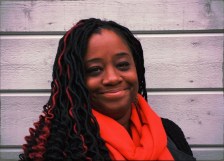 Kiah Morris from the shoulders up, facing the camera, smiling