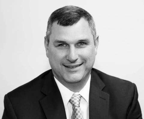 Brendan Cox in a suit, facing the camera